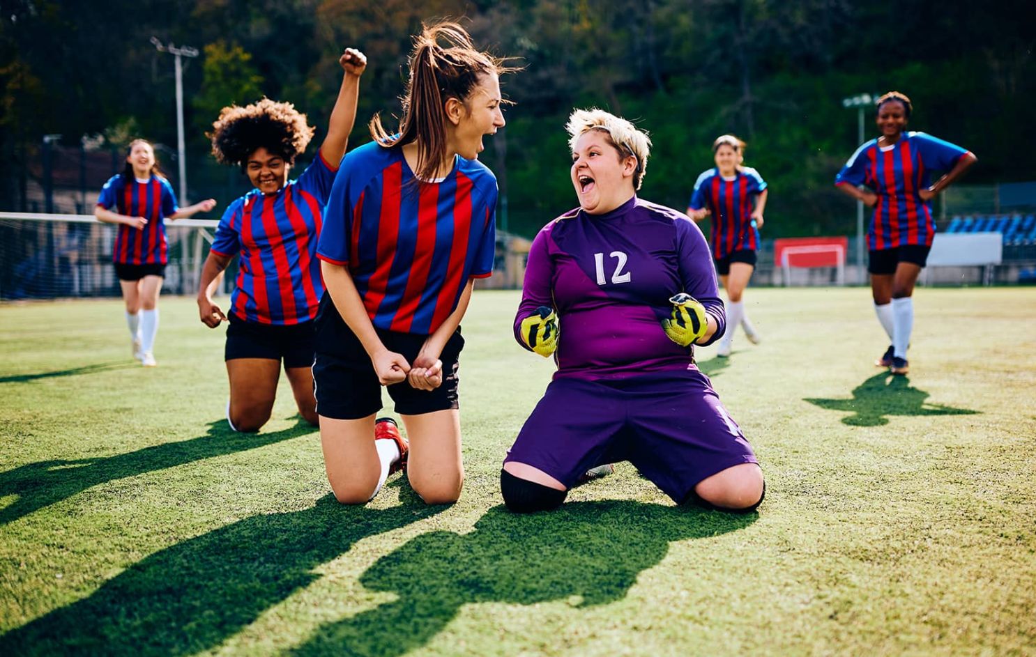 football team celebrating a goal