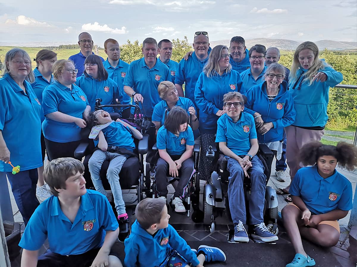 Track and Field athlete being helped to her feet