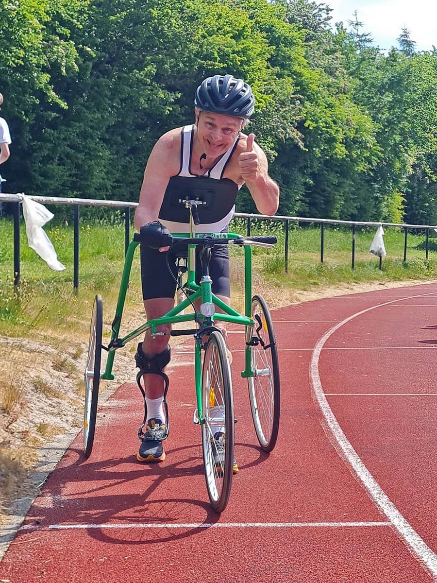 group photo of frame runners on athletics track