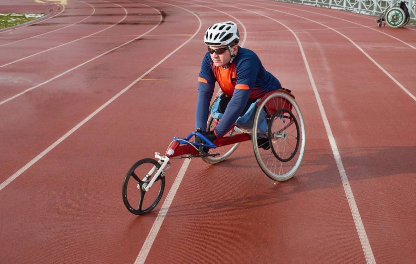 competitive wheelchair athlete preparing for race