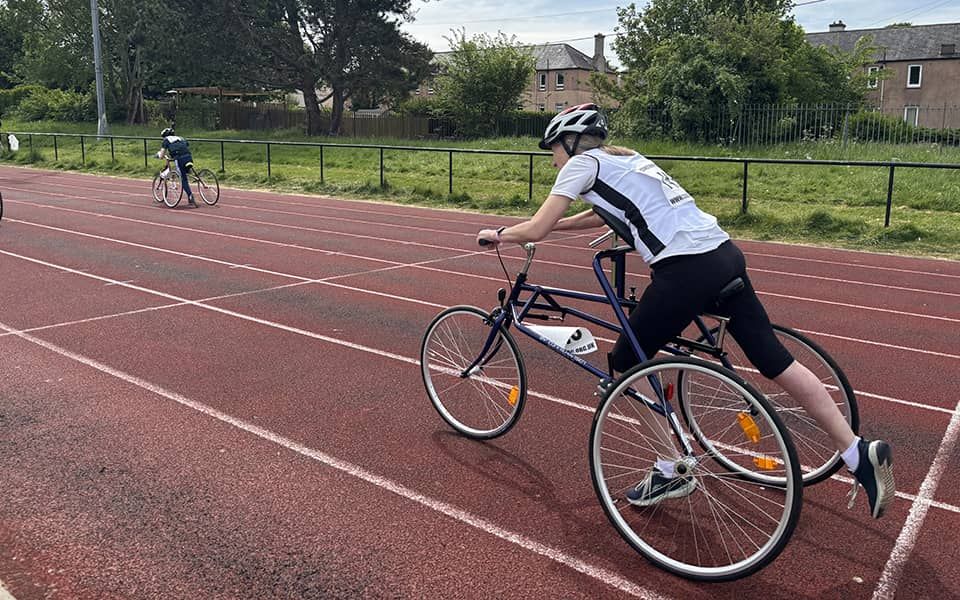 frame running showing Catherine on an athletics running track